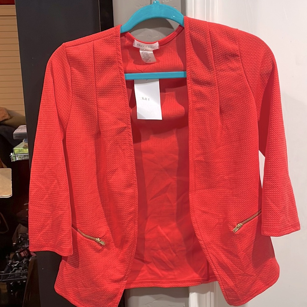 Blazer coral tone size medium half sleeve length. Gold zipper accent.